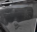Door panel with a dent