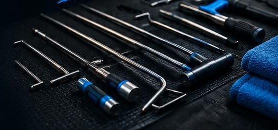 Professional PDR rods and tools laid out on a mat